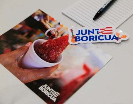 Junte Boricua promo items: postcard, notebook, pen and sticker. Photo by: Juan Carlos Gonzalez